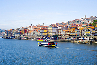 View across the Duoro River towards Porto's historic centre and embankment promenade, UNESCO World Heritage Site, Porto, Norte, Portugal, Europe