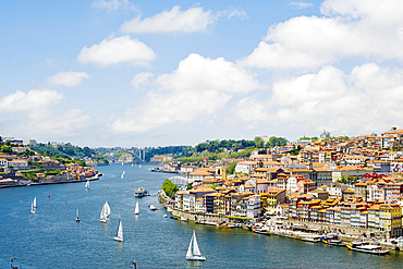 A view of Porto's historic centre and the Duoro River flowing towards its estuary and the Atlantic Ocean, Porto, Norte, Portugal, Europe