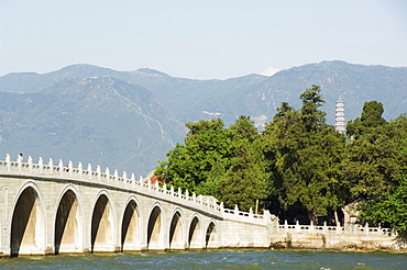 Seventeen Arch Bridge on Kunming Lake, built in 1750 during Emperor Qialong's reign, leads to South Lake Island, Yihe Yuan (The Summer Palace), UNESCO World Heritage Site, Beijing, China, Asia