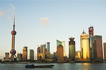 The Oriental Pearl Tower and modern buildings on the skyline in Pudong new area on the banks of Huangpu River, Pudong, Shanghai, China, Asia