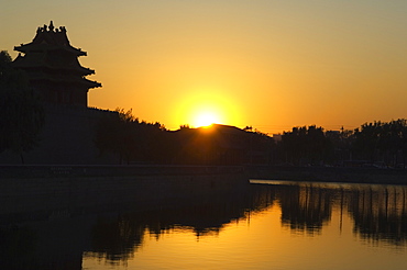 Sunset on a watch tower on the wall of the Forbidden City Palace Museum, Beijing, China, Asia