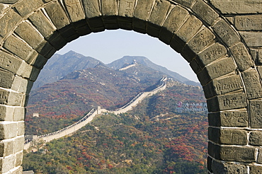 Autumn colours seen through an arch on The Great Wall of China, UNESCO World Heritage Site, Badaling, China, Asia