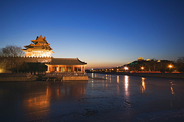 Forbidden City Palace Museum moat and Jingshan Park pavilions illuminated at night, UNESCO World Heritage Site, Beijing, China, Asia