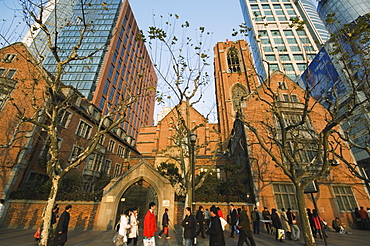 A Christian church among modern skyscrapers on Renmin Square, Puxi area, Shanghai, China, Asia