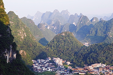 Karst limestone scenery surrounding a village in Yangshuo, near Guilin, Guangxi Province, China, Asia