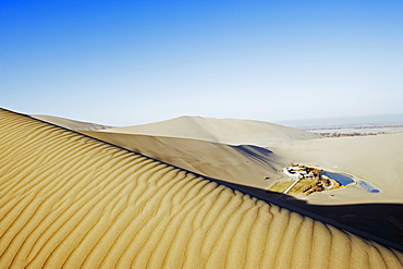 Ming Sha sand dunes and pavilion at Crescent Moon Lake, Dunhuang, Gansu Province, China, Asia