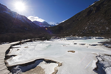 Colourful pools of calcite deposit frozen at Huanglong National Park, UNESCO World Heritage Site, Sichuan Province, China, Asia