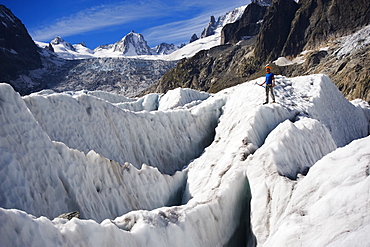 Aclimber in a crevasse field on Mer de Glace glacier, Mont Blanc range, Chamonix, French Alps, France, Europe