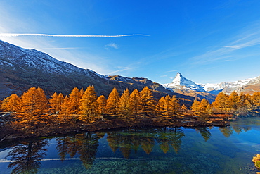 The Matterhorn, 4478m, and Grindjisee mountain lake in autumn, Zermatt, Valais, Swiss Alps, Switzerland, Europe