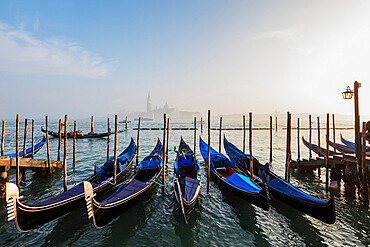 Gondola and San Giorgio Maggiore Church across Basino di San Marco, Venice, UNESCO World Heritage Site, Veneto, Italy, Europe