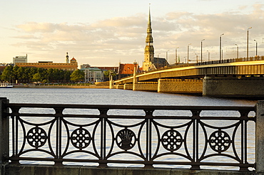 Church of St. Peter and the Old Town at dusk from across the river Daugava, Riga, Latvia, Baltic States, Europe