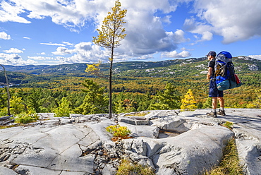 Hiker on La Cloche Silhouette Trail in Killarney Provincial Park, Ontario, Canada, North America