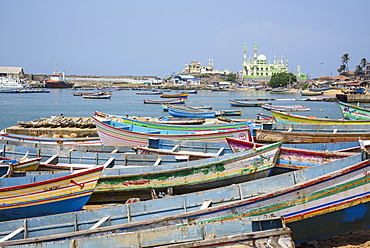 Fishing boats at Vizhinjam beach fish market, near Kovalam, Kerala, India, South Asia