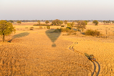 Aerial view of the Okavango Delta from a hot air balloon ride including chase vehicle, Okavango Delta, Botswana, Africa