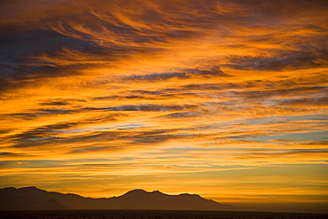 Sunset with deep orange clouds, Bransfield Strait, view from South Shetland Islands to Antarctic Peninsula, Antarctica, Polar Regions