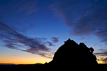 Silhouetted sandstone formation at dawn, Coyote Buttes Wilderness, Vermilion Cliffs National Monument, Arizona, United States of America, North America