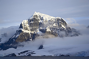 Snow covered coastal mountain, Wiencke Island, Antarctic Peninsula, Antarctica, Polar Regions