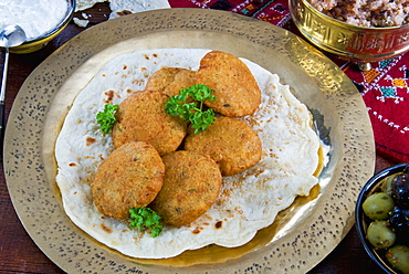 Falafel, a deep-fried balls or patties made from ground chickpeas and or fava beans, Arabic Countries