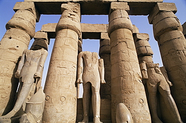 Colonnade and Osiris statues, Luxor Temple, Thebes, UNESCO World Heritage Site, Egypt, North Africa, Africa