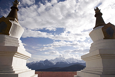 Buddhist stupas on way to Deqin, on the Tibetan Border, with the Meili Snow Mountain peak in the background, Shangri-La region, Yunnan Province, China, Asia