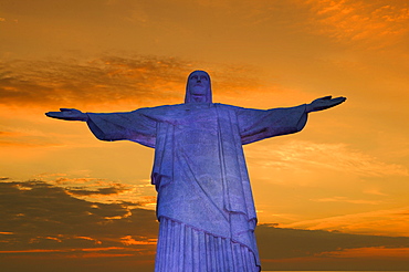 Statue of Christ the Redeemer at sunset, Corcovado, Rio de Janeiro, Brazil, South America