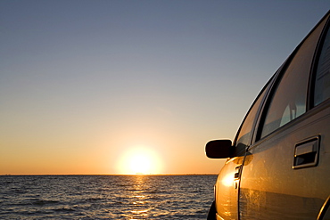 Car on the beach at sunset, Key Byscaine, Miami, Florida, United States of America, North America