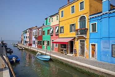 Colorful buildings on canal in Burano, Italy, Europe