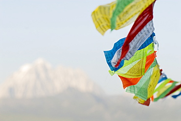 Prayer flags blowing in wind, Snow mountain, Tagong, Sichuan, China, Asia