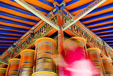 Spinning prayer wheels, Xiahe monastery, Xiahe, Gansu, China, Asia