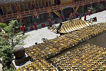 Candles and novices, Nanwu temple, Kangding, Sichuan, China, Asia