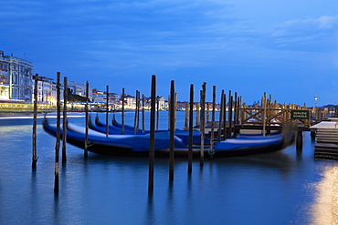 Gondolas moored at night at Campo della Salute on the Grand Canal, Venice, UNESCO World Heritage Site, Veneto, Italy, Europe