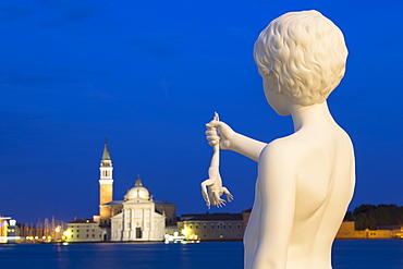 Night shot of Boy with Frog statue by Charles Ray, outside Dogana di Mare, with San Giorgio Maggiore in the distance, Venice, UNESCO World Heritage Site, Veneto, Italy, Europe