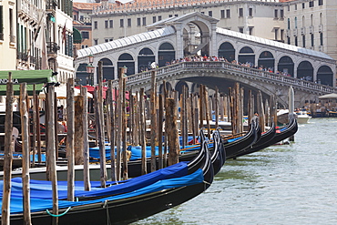 Moored gondolas and the Rialto Bridge from the Grand Canal, Venice, UNESCO World Heritage Site, Veneto, Italy, Europe