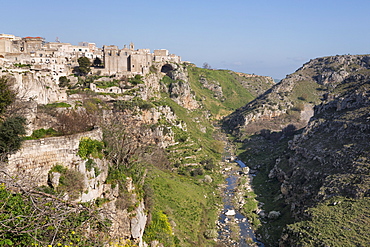 View of Sant'Agostino Convent in the Sassi area of Matera and ravine, Basilicata, Italy, Europe