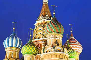 Onion domes of St. Basil's Cathedral in Red Square illuminated at night, UNESCO World Heritage Site, Moscow, Russia, Europe