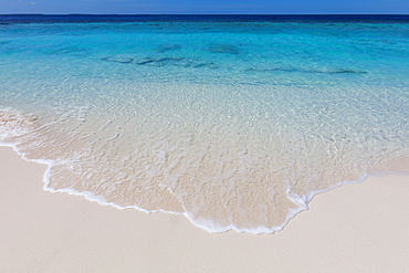 The crystal clear water of the Indian Ocean on an island in the Maldives, Indian Ocean, Asia