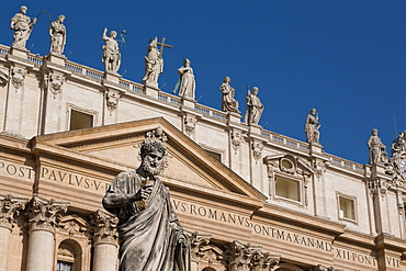 Statue and the facade of the Basilica of St. Peter's, UNESCO World Heritage Site, Vatican, Rome, Lazio, Italy, Europe