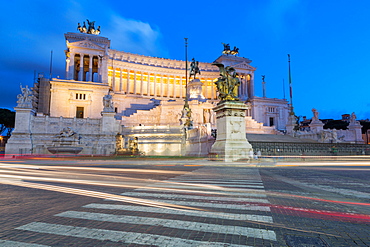 Moving traffic around Piazza Venezia with the Victor Emmanuel Monument at night, Rome, Lazio, Italy, Europe