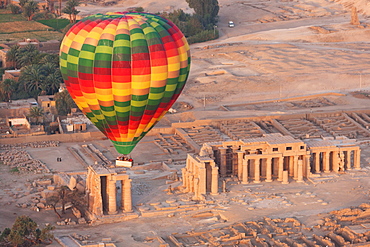 A hot air balloon flight over a ruined temple near Luxor, Thebes, Egypt, North Africa, Africa