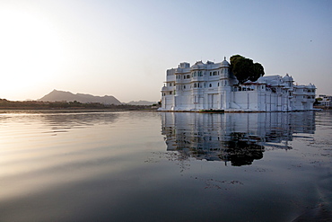 Perfect reflection of Lake Palace Hotel, situated in the middle of Lake Pichola, in Udaipur, Rajasthan, India, Asia