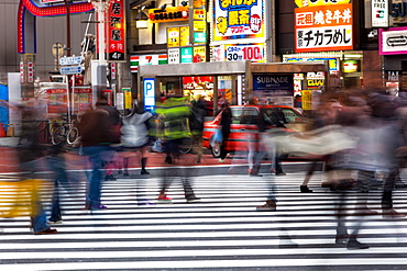 Crowds crossing a street in the Ginza district in the evening, Tokyo, Japan, Asia