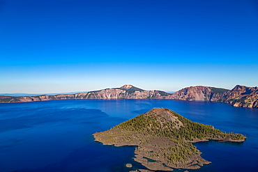 Wizard Island and the still waters of Crater Lake, the deepest lake in the U.S.A., part of the Cascade Range, Oregon, United States of America, North America