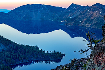 Wizard Island and the still waters of Crater Lake at dawn, the deepest lake in the U.S.A., part of the Cascade Range, Oregon, United States of America, North America