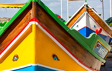 Detail of traditional brightly painted fishing boat in the harbour at Marsaxlokk, Malta, Mediterranean, Europe