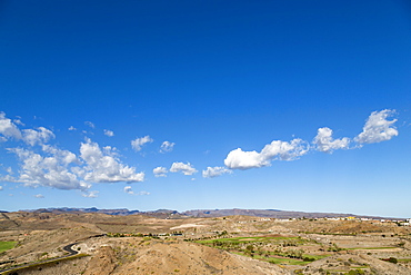 Looking towards the rugged mountains of Parque Natural Pilancones from near Maspalomas, Gran Canaria, Canary Islands, Spain, Europe