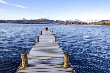 Frost covered jetty at the north end of Windermere near Ambleside, with rugged snow covered mountains including Helvellyn, Lake District National Park, UNESCO World Heritage Site, Cumbria, England, United Kingdom, Europe