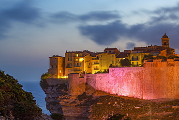 Night view of the Citadel and old town of Bonifacio perched on rugged cliffs, Bonifacio, Corsica, France, Mediterranean, Europe