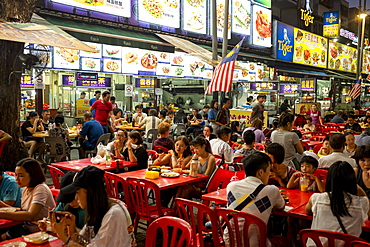 People enjoying a meal in Bukit Bintang food street at night in the capital city of Kuala Lumpur, Malaysia, Southeast Asia, Asia