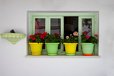 Colourful pots on windowsill in Naxos Town, Naxos, the Cyclades, Aegean Sea, Greek Islands, Greece, Europe