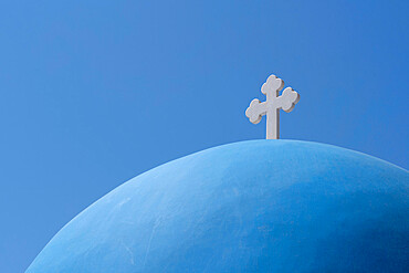 The blue dome of Church of Agios Nikolaos in Oia, overlooking the caldera, Santorini, The Cyclades, Aegean Sea, Greek Islands, Greece, Europe